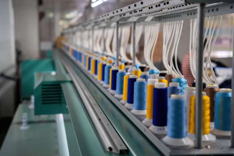 Rolls of thread on a loom