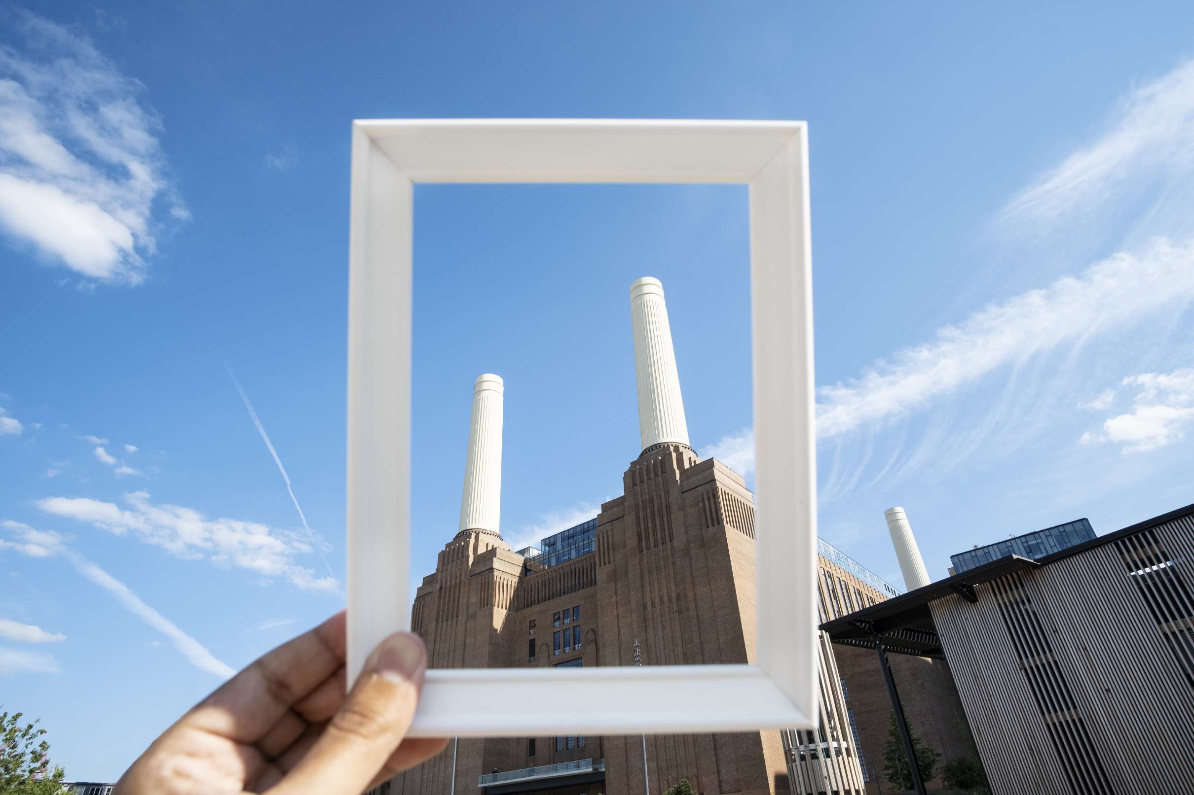 Factory chimneys through a picture frame